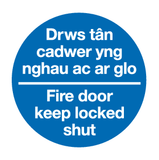 Drws tan cadwer yng nghau ac ar glo Fire door keep locked shut MJN Safety Signs Ltd